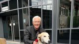 Paul O'Grady outside with a dog