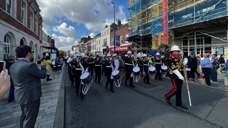 The Band of the Royal Marines marches through Maidstone watched by shoppers