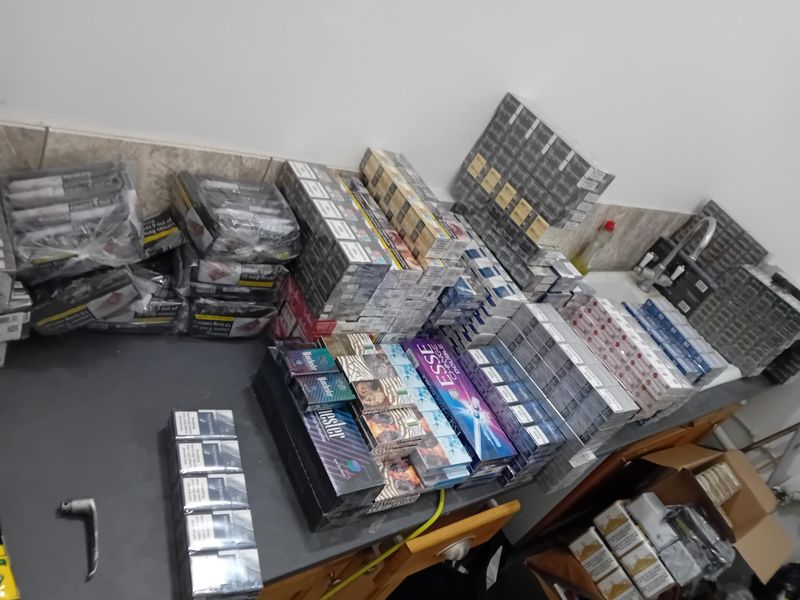 Photo of stacks of illicit tobacco products seized in Trading Standards operation 