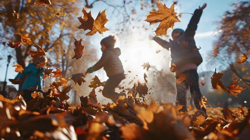 Children playing in autumn leaves