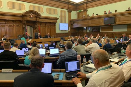 A wide view of the council chamber at County Hall in Maidstone during the full council meeting showing Members