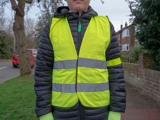 An image of someone wearing a hi-viz and bright gloves.