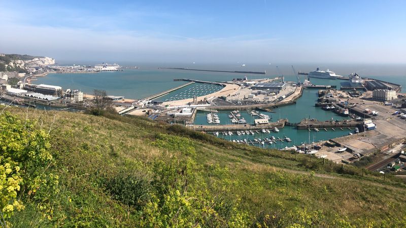 Image of the Port of Dover. Photograph taken from up high in the hills looking down on the Port of Dover on a sunny day.