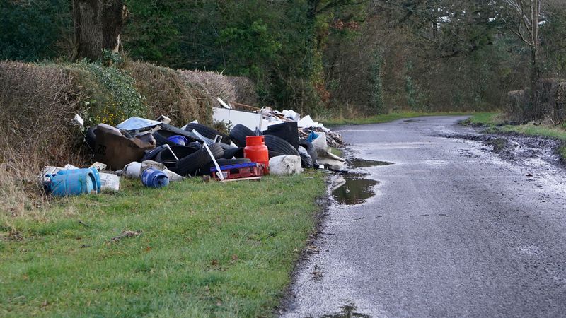 A large amount of mixed flytipping on the side of the road