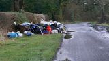 A large amount of mixed flytipping on the side of the road
