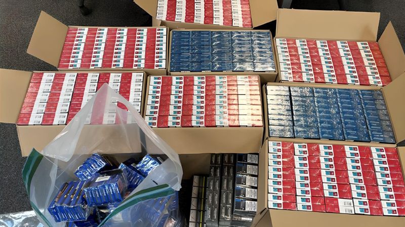 Hundreds of red and blue plastic wrapped packets of cigarettes in cardboard boxes seized in an operation run by Kent Trading Standards and Kent Police