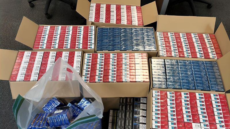 Hundreds of red and blue plastic wrapped packets of cigarettes in cardboard boxes seized in an operation run by Kent Trading Standards and Kent Police