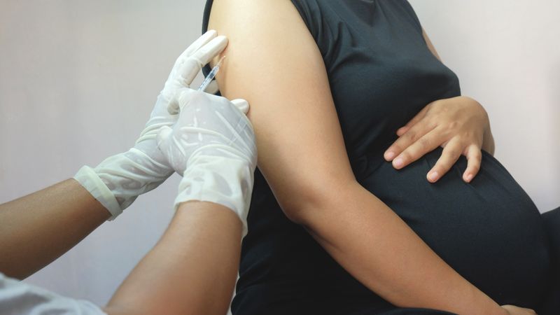 Pregnant woman receives a vaccination
