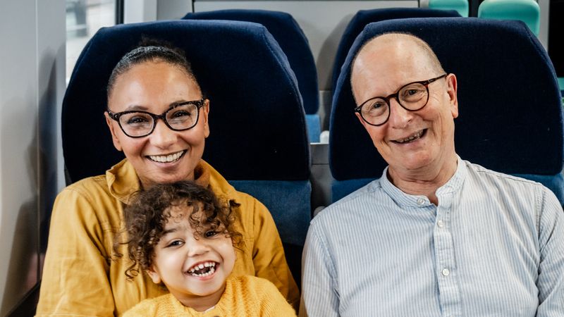 Rachael, Daniel and adopted daughter Winnie on a train