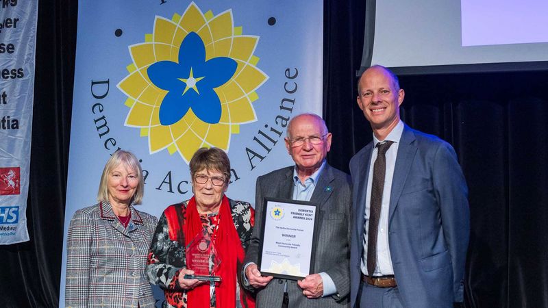 Cabinet Member for Adult Social Care Dan Watkins presents awards