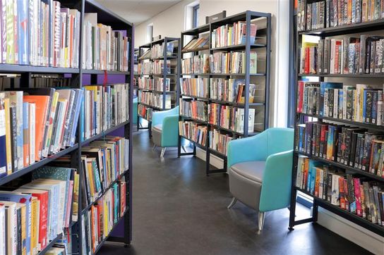 An interior image of Broadstairs Library showing shelves full of books 