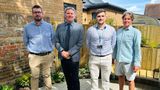 Four representatives from KCC and Southern Water stand together for a picture in the new garden at Whitstable Library