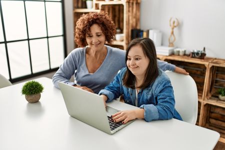 Girl with Learning Disablity using laptop
