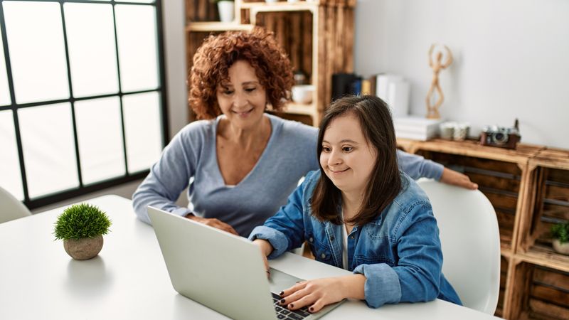 Girl with Learning Disablity using laptop