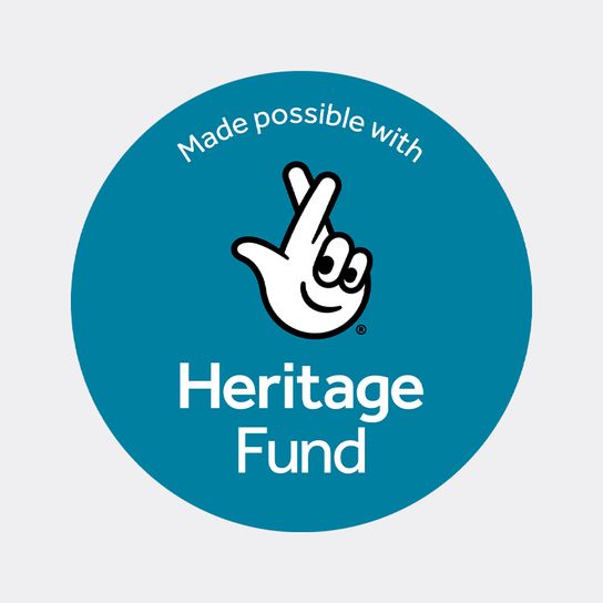 Heritage Fund acknowledgement logo featuring the National Lottery crossed-fingers symbol inside a teal circle with the text 'Made possible with Heritage Fund'.