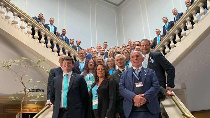 KCC Leader Linden Kemkaran with Members on staircase at County Hall