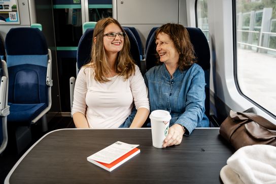 Hazel and adopted daughter Angela on a train