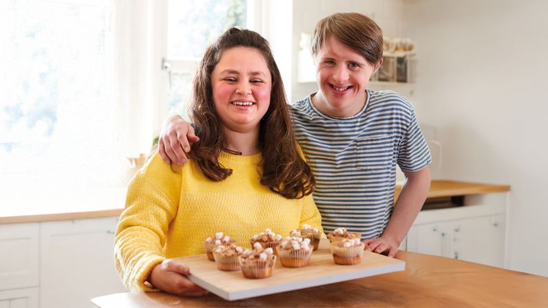 Shared lives carer and person they care for baking