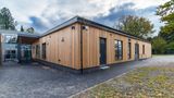 An exterior photo of The Point showing the timber cladding