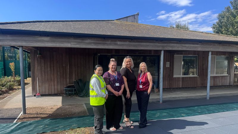 Four women standing infront of a building which will be the new SRP at The Downs Church of England primary school