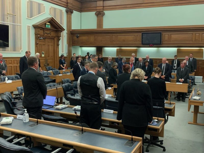 Members of KCC observe a minute's silence before paying tribute to the Queen in the council chamber at County Hall