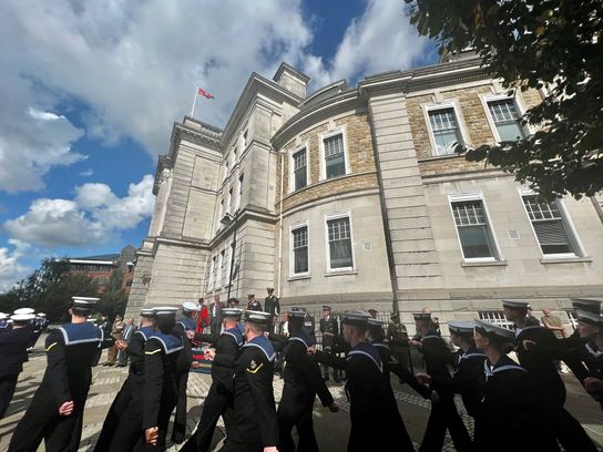 The HMS Kent ship's company march past County Hall in Maidstone