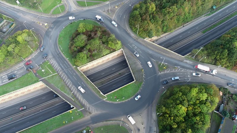 Drone photo which shows a birds eye view of a roundabout.