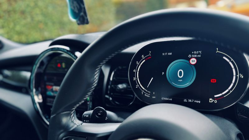 Close up of a vehicle dashboard showing the odometer and milometer