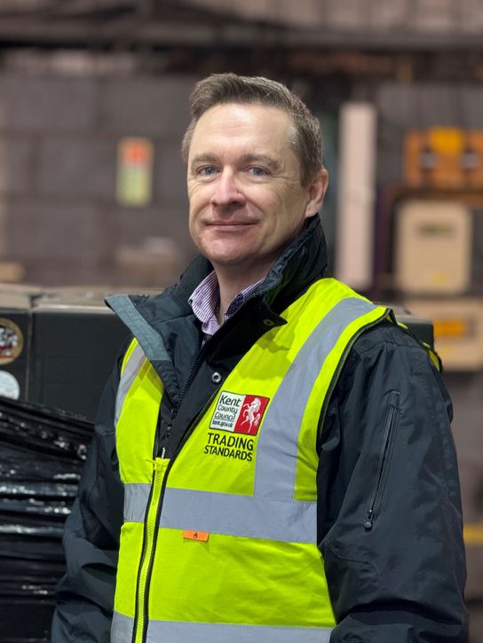 Jim Whiddett in high vis vest in a warehouse setting