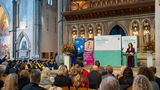 Linden Kemkaran on a stage at the Kent and Medway Apprentice Graduation Ceremony