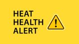 Black writing over a yellow background says Heat-Health Alert