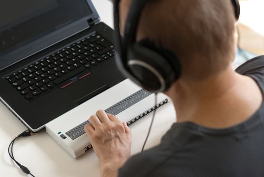 Looking over the shoulder of an adult using a screen reader