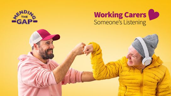 Carer bumping fists with the person they care for
