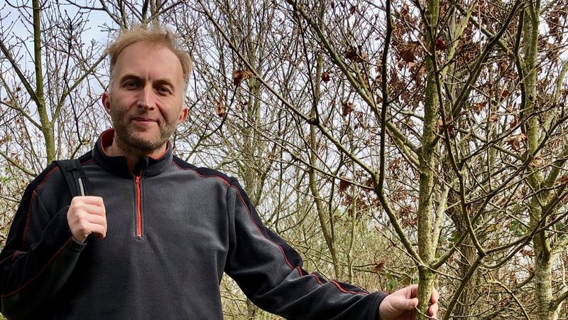 New Cabinet Member for Environment Rob Thomas standing in woodland