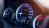 Close up of a vehicle dashboard showing the odometer