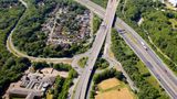 A drone image of roads and greenery.