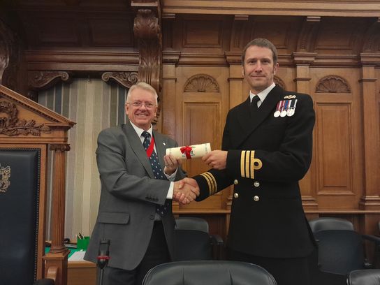 Chairman of KCC Gary Cooke presents the Freedom of the County of Kent to HMS Kent's Commanding Officer Jez Brettell