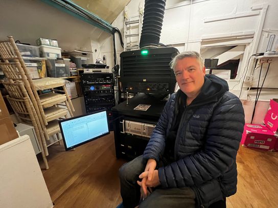 Simon Ward from the Palace Cinema in Broadstairs in front of the projector