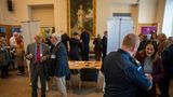 A packed and busy exhibition room