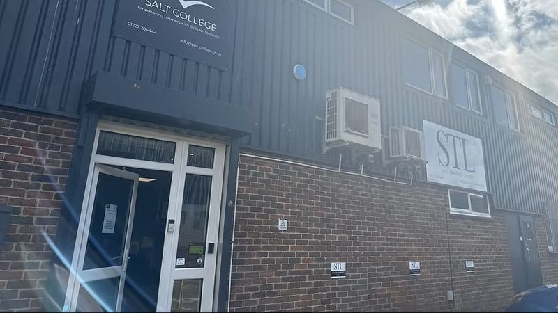 Exterior of salt college  - brick building with Salt college sign