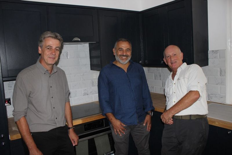 Steve Grimshaw, the No Use Empty programme manager, Michael Papa Adams and KCC Cabinet Member Derek Murphy in one of the new kitchens.