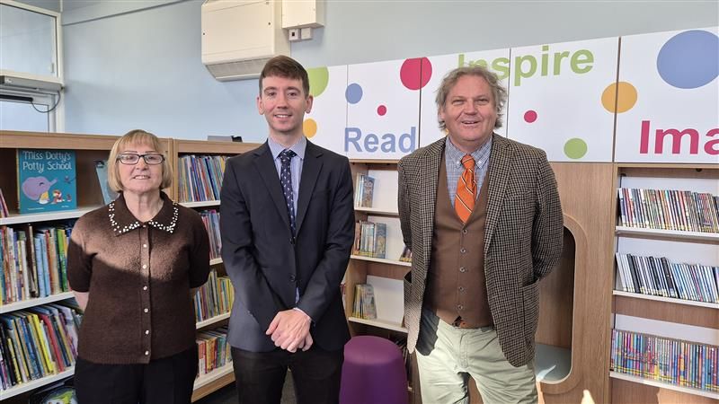 Mary Lawes,&nbsp;Ben Fryer and Paul Webb standing in the children's section at Temple Hill Library