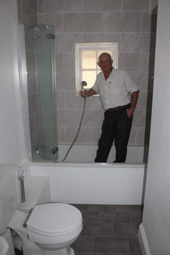KCC Cabinet Member for Economic Development Derek Murphy tries out one of the new bathrooms.