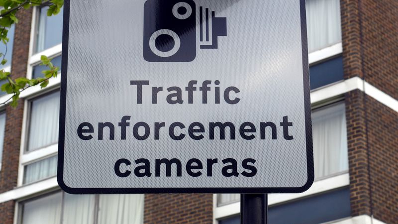 A road sign with an image of a camera and below it the sign reads: "Traffic enforcement cameras"