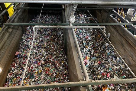 View of mixed household recycling being processed at N+P's Crayford facility, with materials separated into different streams for recycling.