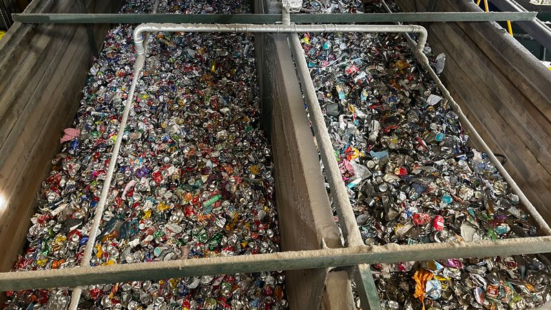 View of mixed household recycling being processed at N+P's Crayford facility, with materials separated into different streams for recycling.