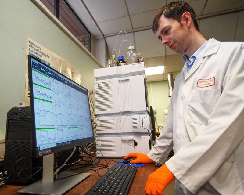 A senior scientific officer at Kent Scientific Services at work on the testing equipment.