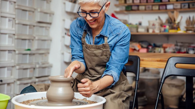 A woman at a potter's wheel in Adult Education class