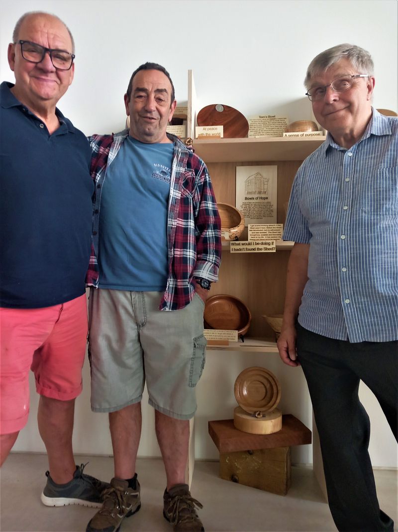 Members of Broadstairs Town Shed with their Hope Exhibition creation - wooden Bowls of Hope