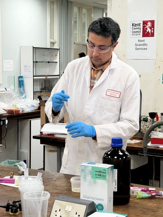 A scientist at Kent Scientific Services tests the contents of a disposable vape